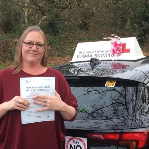 Natalie Heaven holding her practical driving test pass certificate